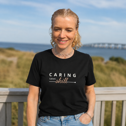 T-shirt feminina de algodão orgânico "Caring takes skill"