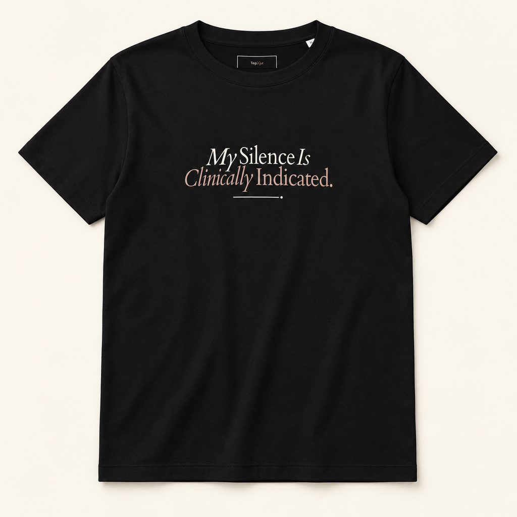 T-shirt preta My Silence Is Clinically Indicated, vista frontal completa sobre fundo creme.