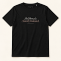T-shirt preta My Silence Is Clinically Indicated, vista frontal completa sobre fundo creme.